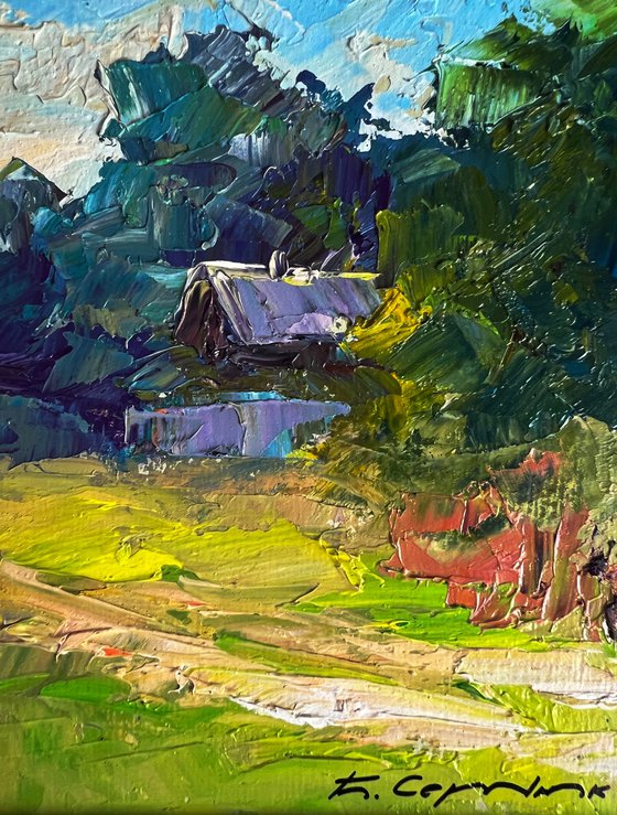 A Red Cow near the Houses