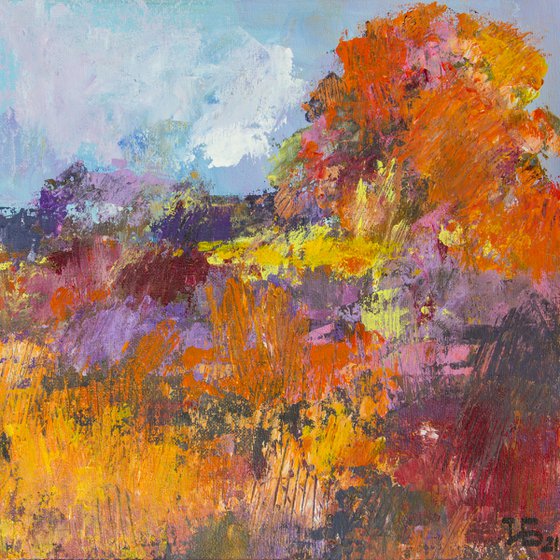 Landscape with wildflowers and a big red-orange tree