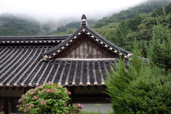 Tiled Eaves Against the Fog