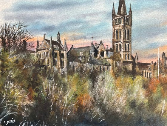 Glasgow university under a setting sun