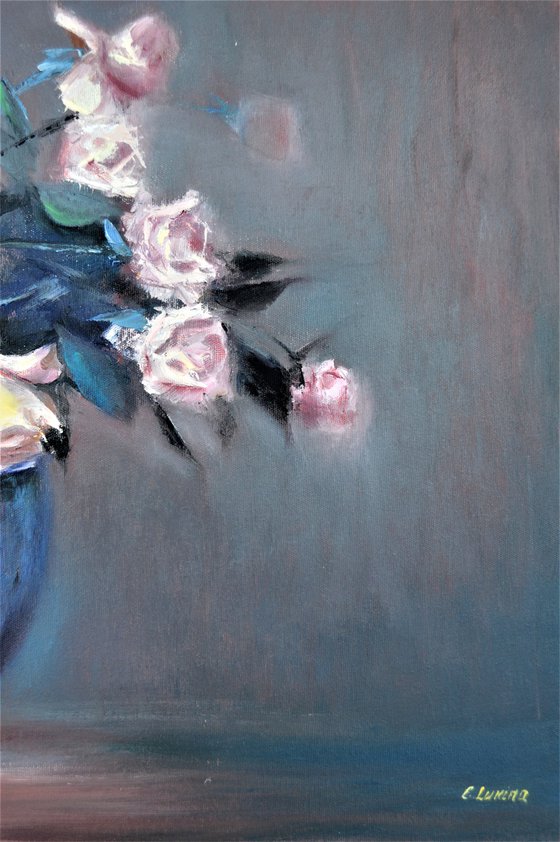 Roses in a blue vase