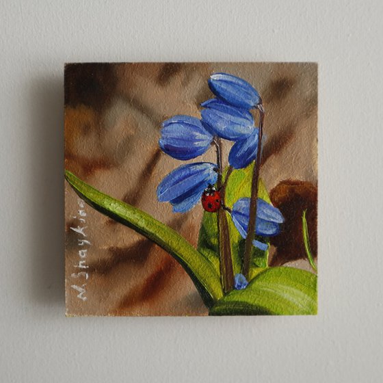 Blue Spring Flowers with Ladybug