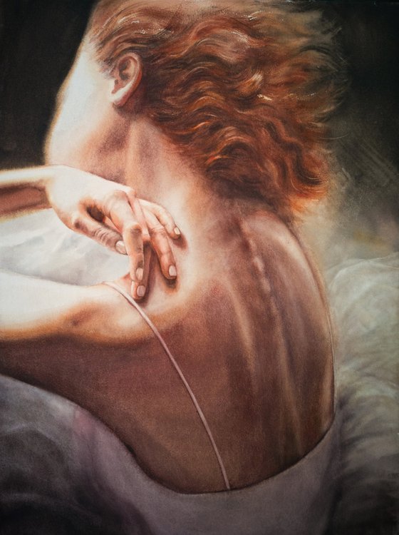 Back of a ballerina sitting