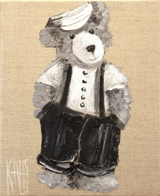 Little teddy bear in overalls