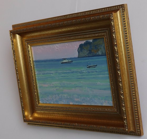 Sunset. Boats on the sea