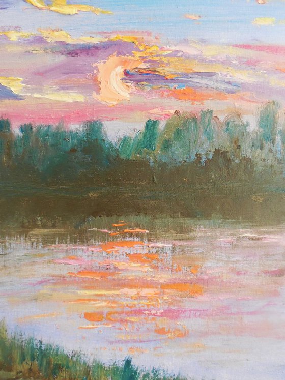 Pink sunset at the river. Plein air painting