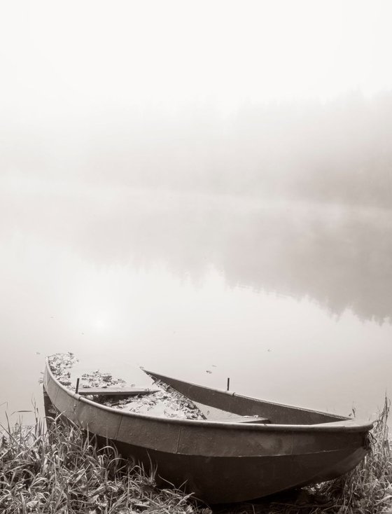 Sunken Boat on the foggy lake