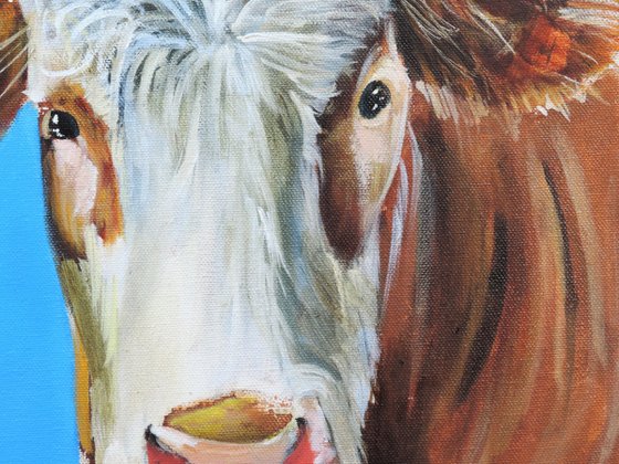 Cow painting a portrait in blue