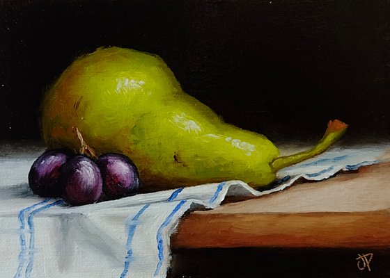 Pear on cloth still life