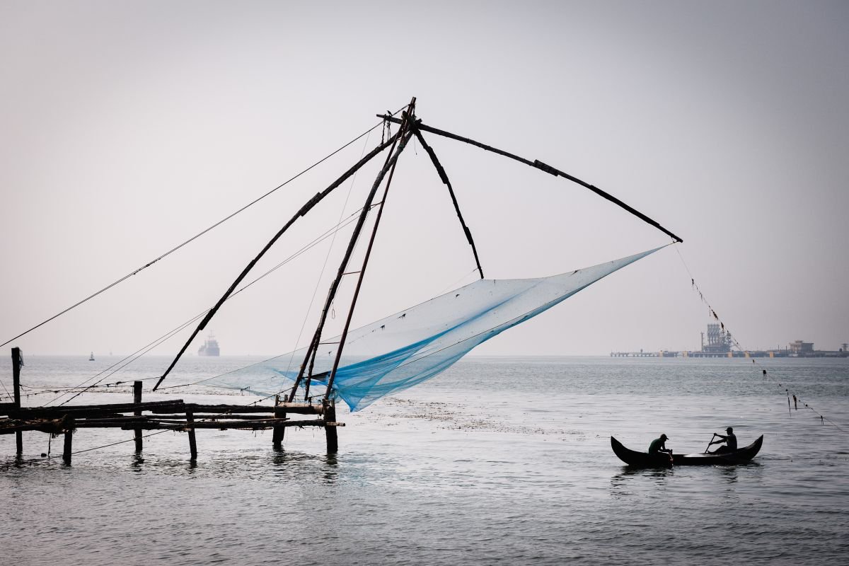 Fishermen, Fort Kochi. (59x42cm) by Tom Hanslien