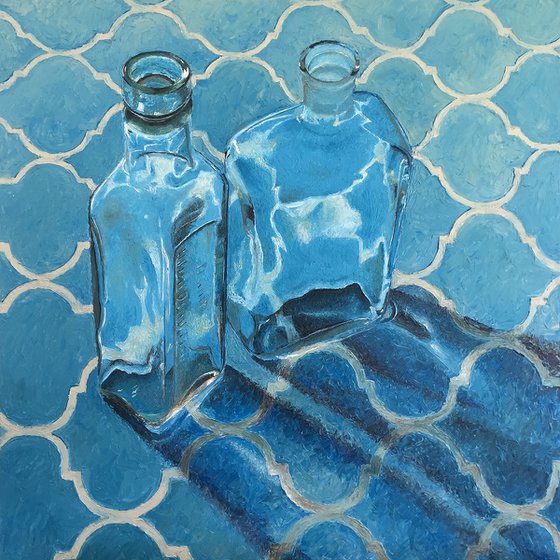 Vintage bottles on blue