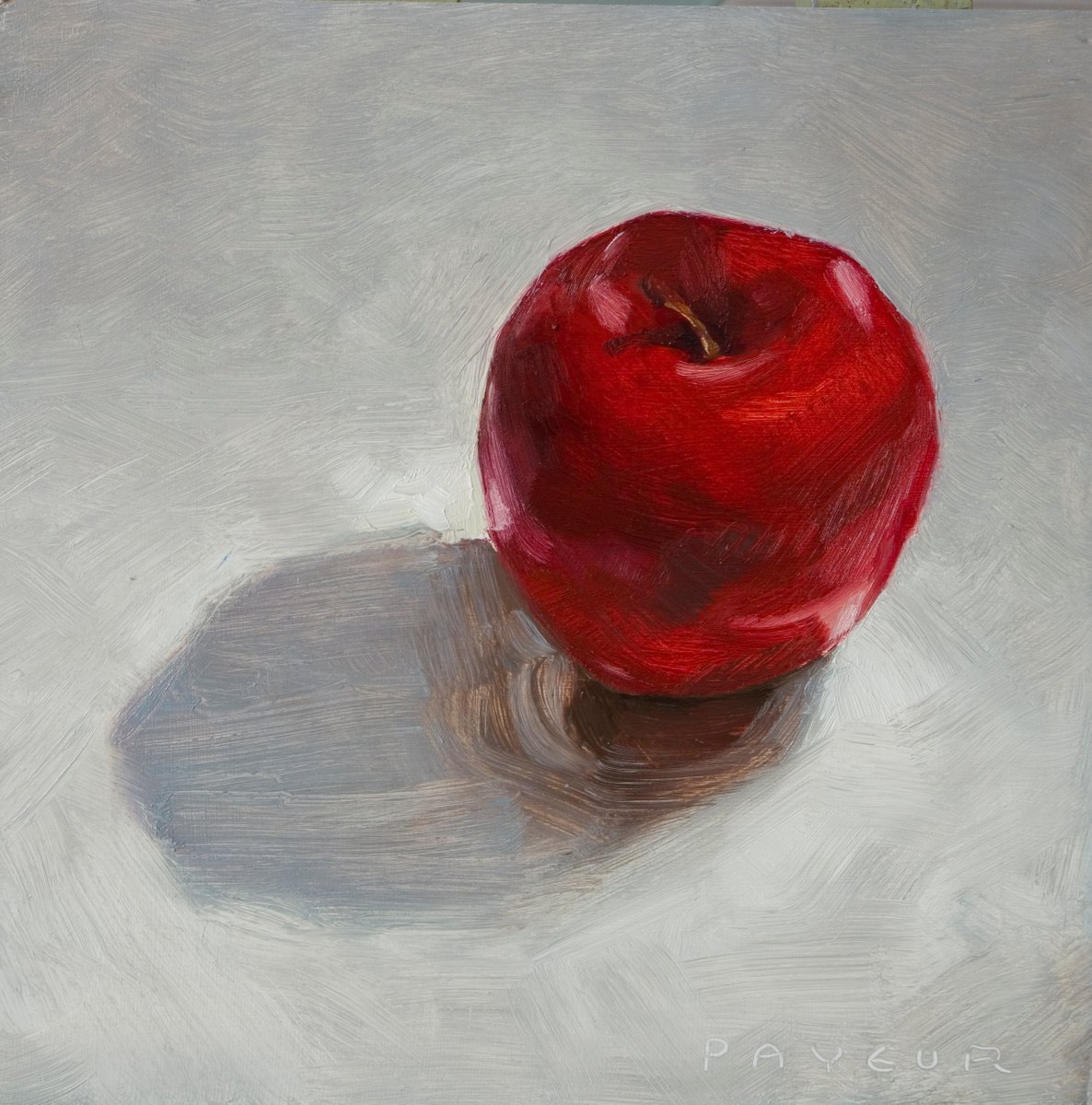 still life of red apple on a white background by Olivier Payeur