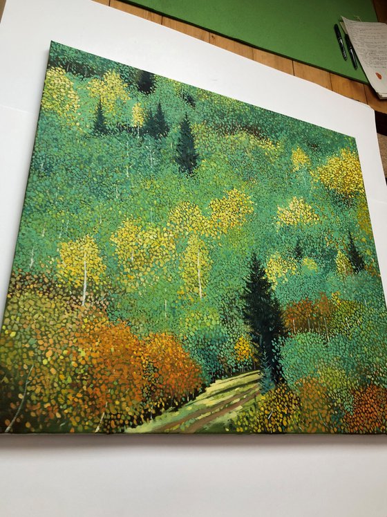 Green forest with yellow aspens