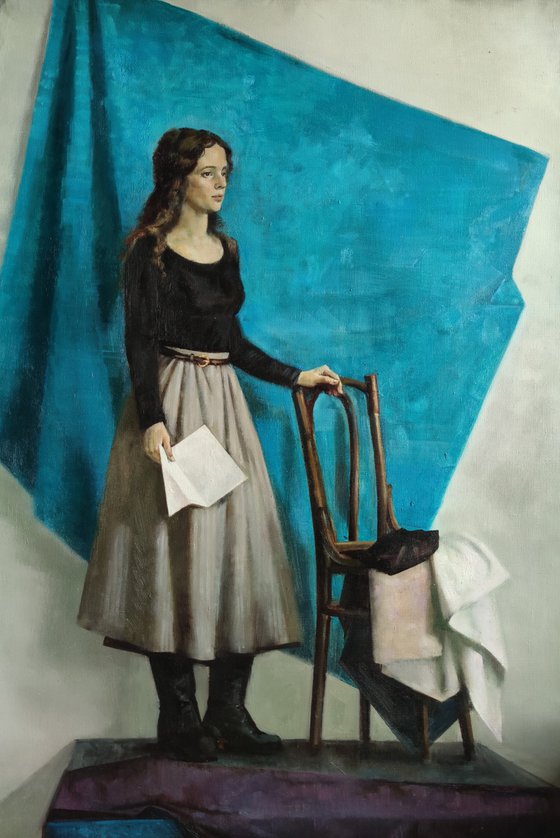 A girl with a letter in blue