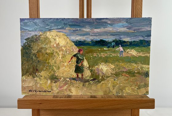 Working in the Field under a Blue Clear Sky