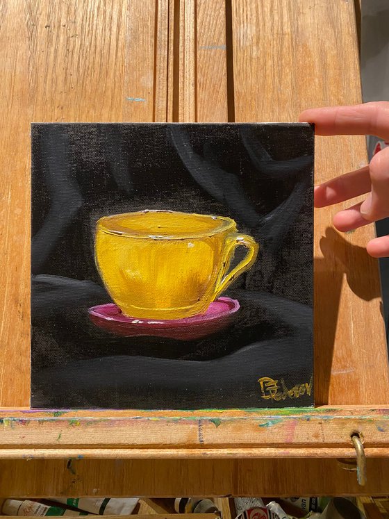 Yellow coffee cup still life
