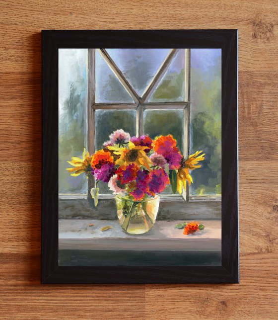 Vase of flowers on a window sill