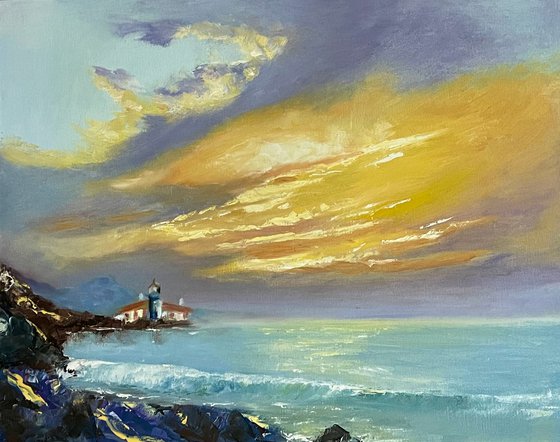 LIGHTHOUSE IN THE RAYS OF THE SUNSET