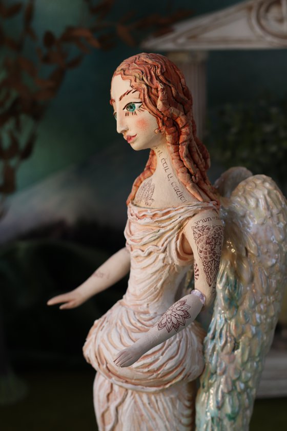 Angel with a tattoo. Ceramic OOAK sculpture.