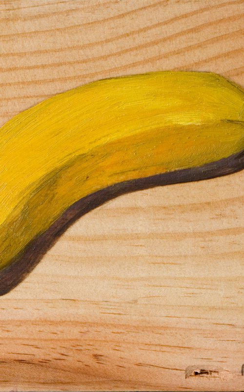 banana on a wood board for food lovers by Olivier Payeur