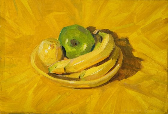 apple bananas and lemon on yellow