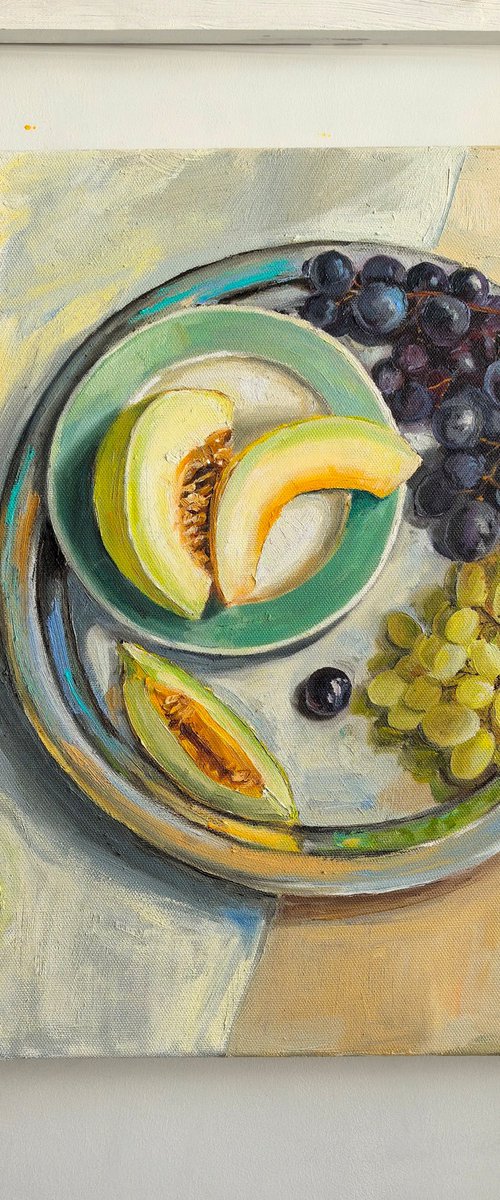 Melon slices with grapes by Leyla Demir