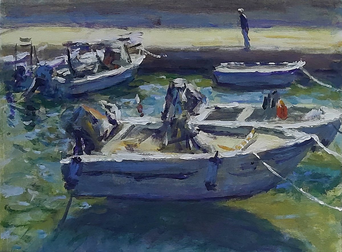 Boats in a small harbour by Dimitris Voyiazoglou