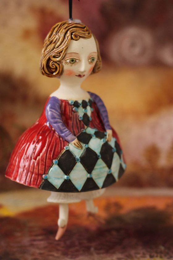 Little girl in red dress. Hanging sculpture, bell doll by Elya Yalonetski