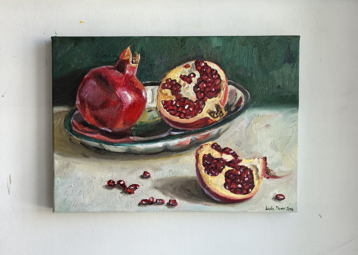 Pomegranates on metal tray by Leyla Demir