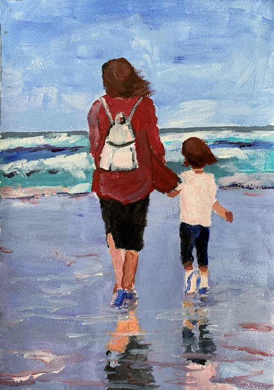 Mom with a kid on the beach.(3)