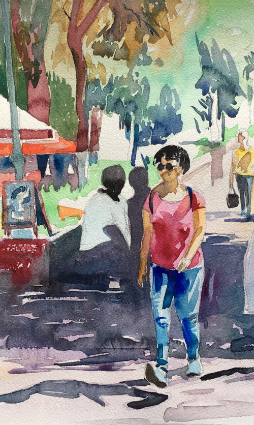 People walking along the alley on a sunny day by Ole Karako