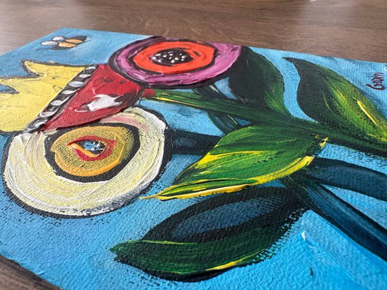 Cartoon flowers and bee
