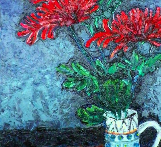 Chrysanthemums in a tall jug