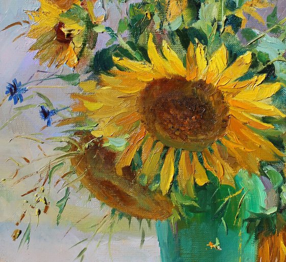 Sunflowers in a green vase