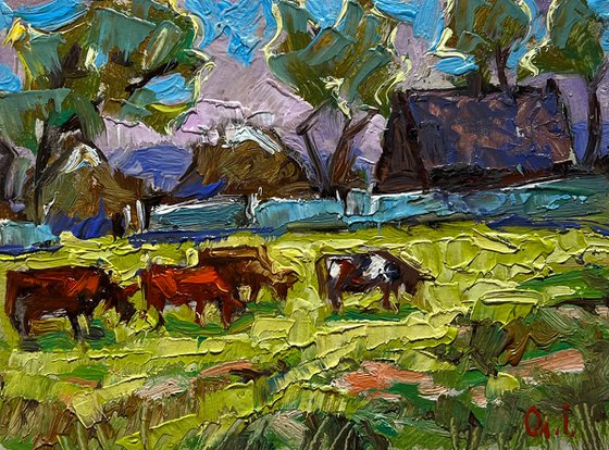 Cows on a green field