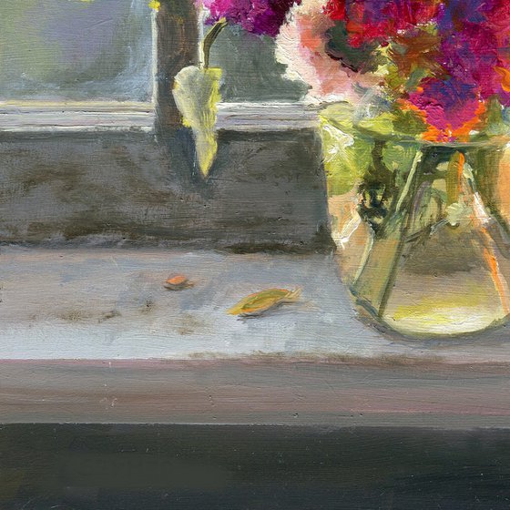 Vase of marigolds on a window