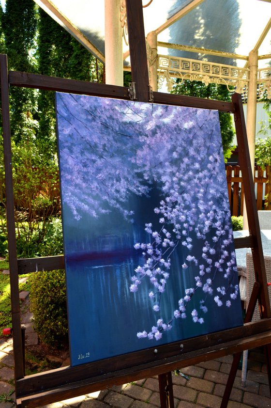 Blooming garden by the pond