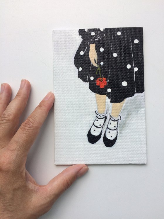 Portrait of a girl in black dress with red poppy - Romantic gift idea