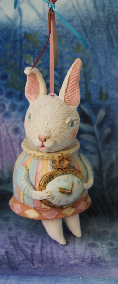 Little rabbit in harlequin dress. Hanging sculpture, bell doll by Elya Yalonetski by Elya Yalonetski