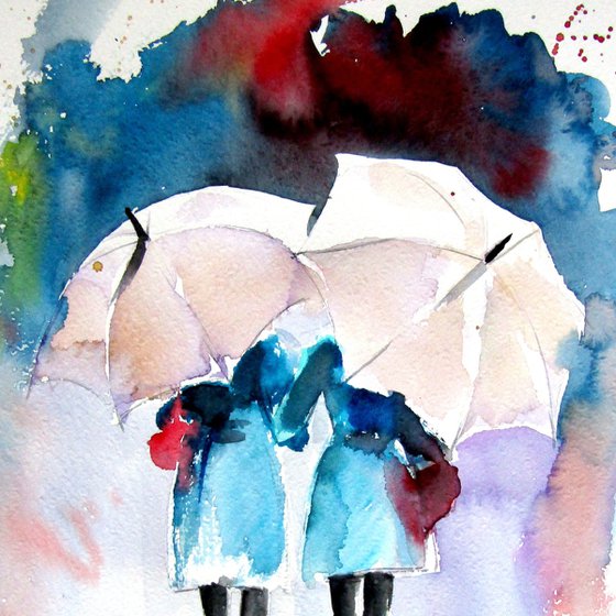 Girlfriends under umbrellas