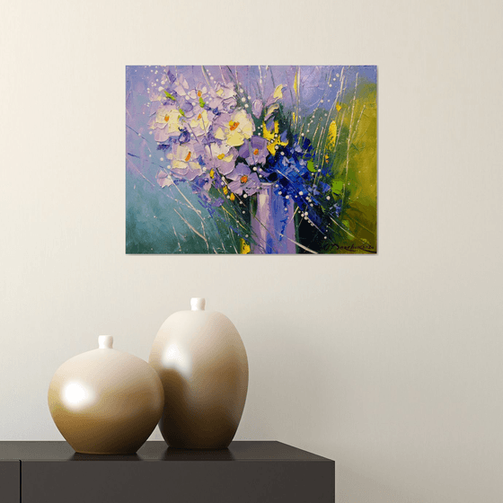 A bouquet of morning flowers in a glass