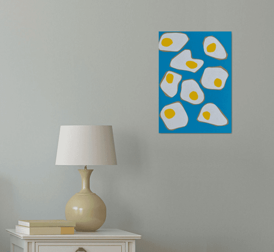 Fried Eggs on Blue Background