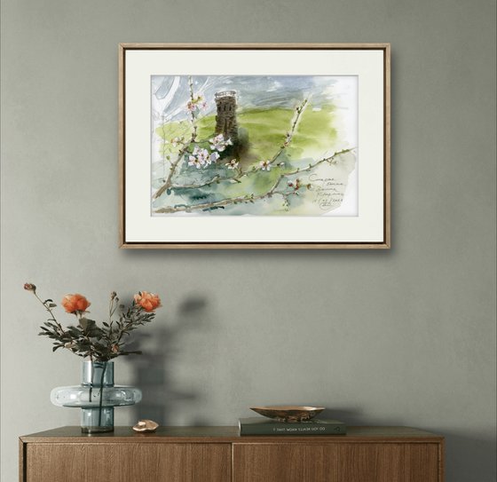 Landscape with an old tower and plum blossoms.