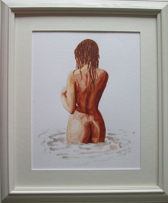 Nude standing in water