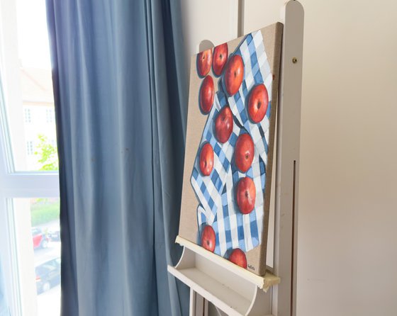 Red apples on a kitchen towel