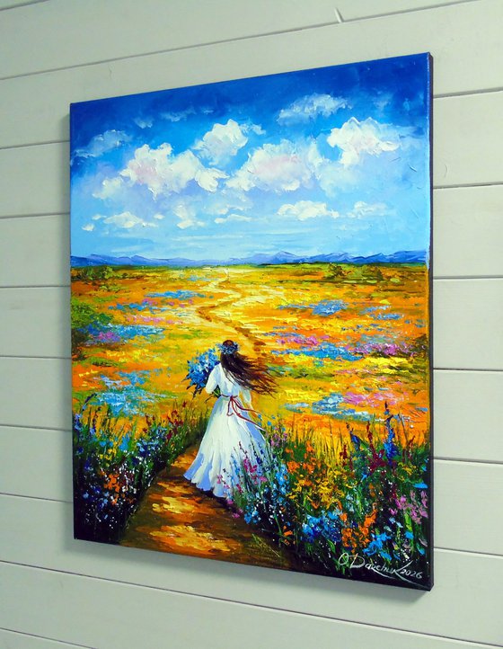 Woman Walking Through a Flower Field
