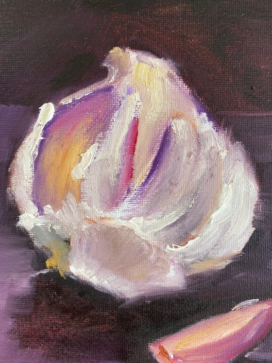 Still life with a head of garlic and a garlic clove