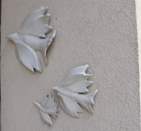 Three doves . Hanging on the wall sculpture.