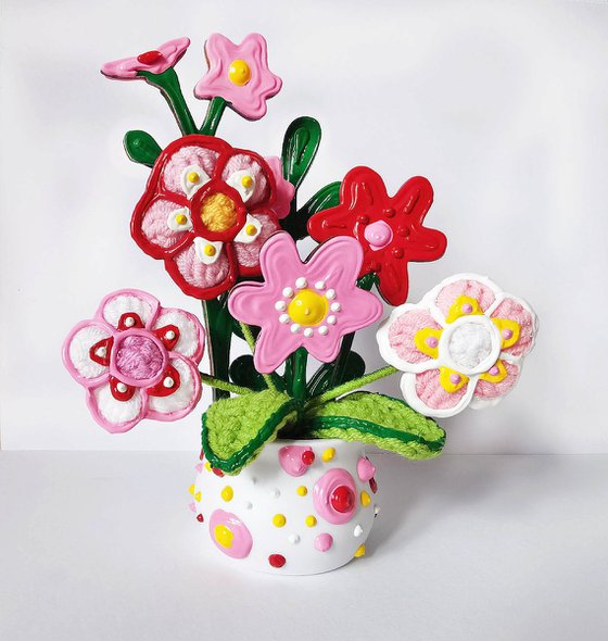 Knitted flowers in vase