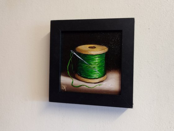 Little  green cotton reel  still life